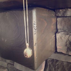 Sterling silver locket.